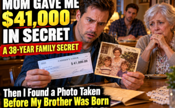 My 72-year-old mother handed me a $41,000 check and whispered, “Your brother can't know yet.” Then I found a photograph dated three years before he was born—and suddenly the money wasn't the biggest secret in the envelope.